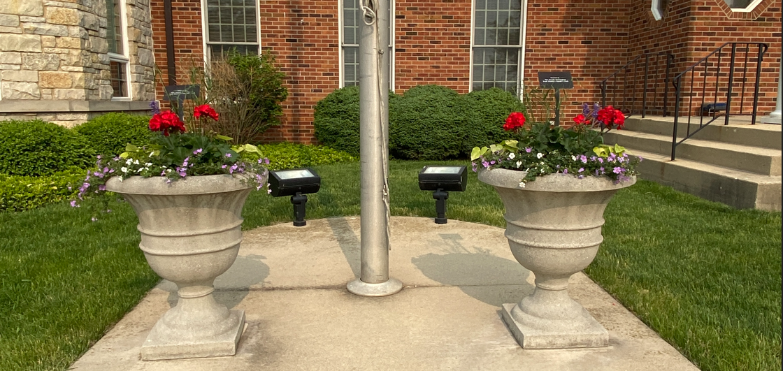 Flower pots in front of the village hall.